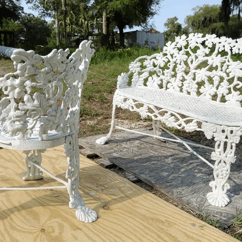 Cast iron garden bench and chair after sandblasting and a fresh white coat