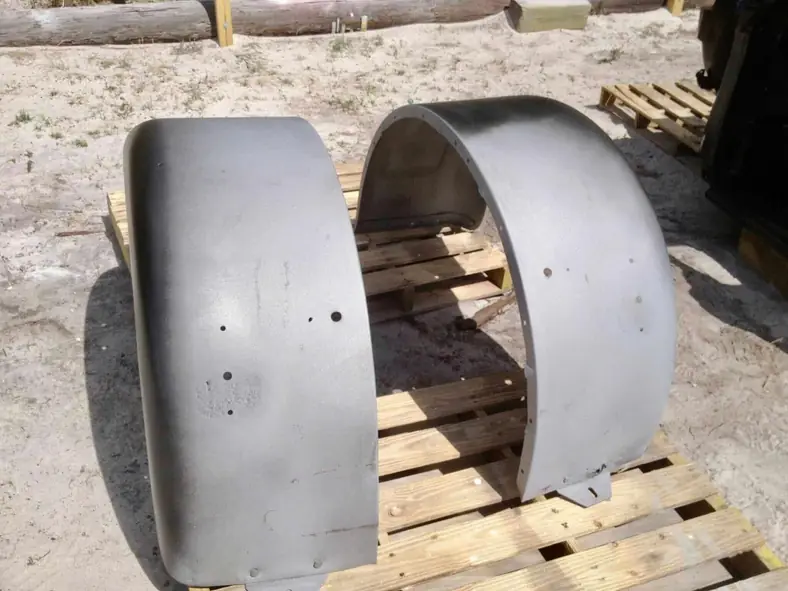 Pair of steel truck fenders stripped and prepped for coating